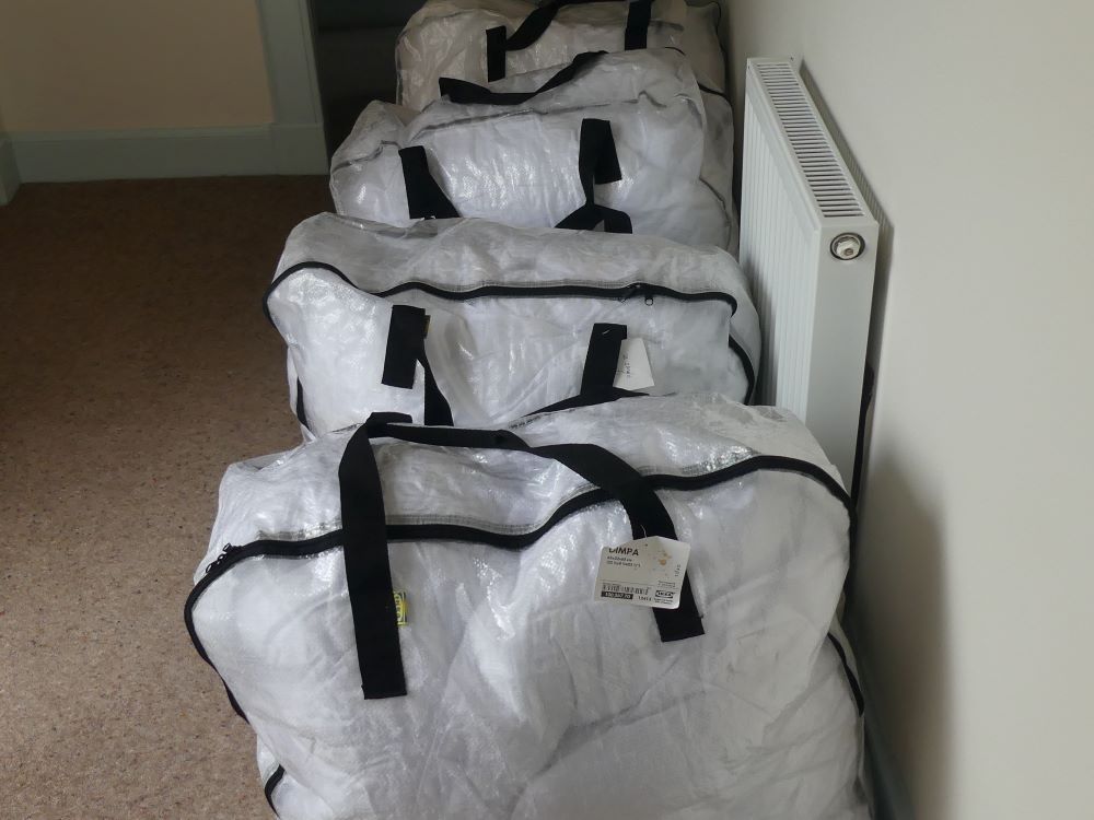 demonstration of bagged duvets ready for departure